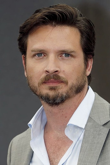 Photo of actor Aden Young